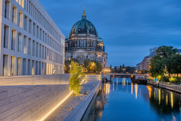 The modern backside of the City Palace, the cathedral and the river Spree in Berlin at dawn