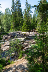 Fototapeta na wymiar Ruskeala waterfalls on the Tohmajoki river in the Republic of Karelia in Russia