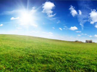 Obraz premium House at the foot of green hill.