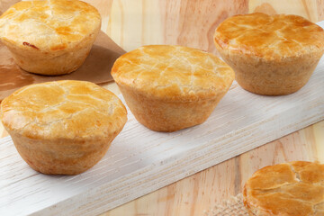 Brazilian traditional snack empada of chicken on the table.