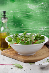 Healthy salad of watercress, purple chard and tomatoes.