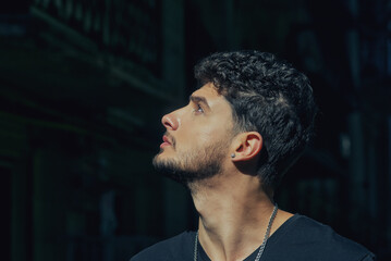 Portrait of a young man close-up of a city street
