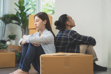 Stressed business due to outbreak of coronavirus, asian young couple moving new relocation...