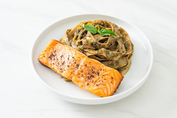 pesto fettuccine spaghetti pasta with grilled salmon fillet