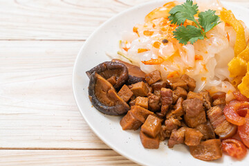 Chinese steamed rice noodle with pork and tofu in sweet soy sauce