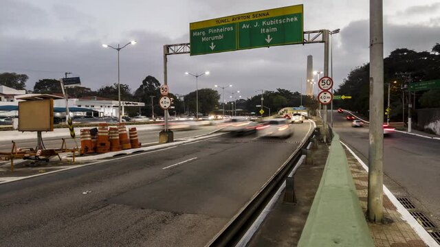 Nightfall time lapse of heavy traffic on 23 de Maio avenue and at the entrance to the Ayrton Senna tunnel, in the south of Sao Paulo