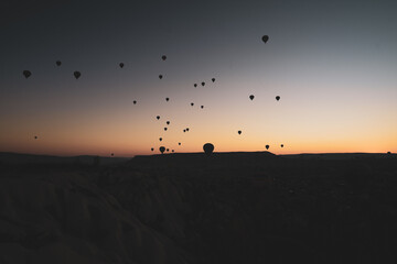 hot air balloons at sunset in the sky