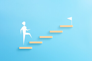 Wooden block stacking as step stair with businessman icon on blue background, Ladder of success in...