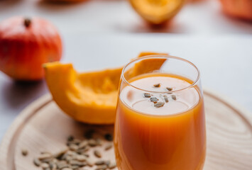 Autumn vegetable juice made of raw pumpkin