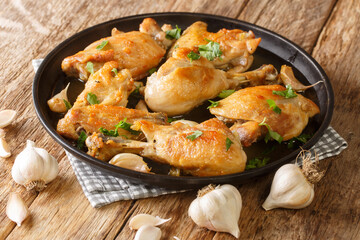 Pollo al Ajillo Garlic Chicken Traditional Spanish tapas dish close-up on a plate on the table. Horizontal