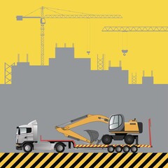 Transportation of the excavator on a low loader. Construction machinery on the background of a building under construction.