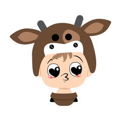 Boy with big heart eyes and kiss lips in a cow hat. Head of cute child with joyful face in carnival costume for holiday, Christmas or New year