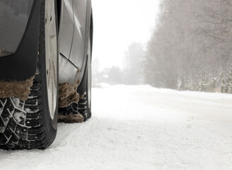 A car on a winter road. The concept of safe driving.