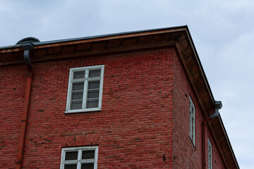 Fototapeta na wymiar old red brick building with windows