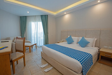 Fototapeta premium Double bed in suite of a luxury hotel room