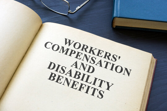 Open Workers Compensation and Disability Benefits law book.