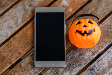 mobile phone and pumpkin. happy Halloween