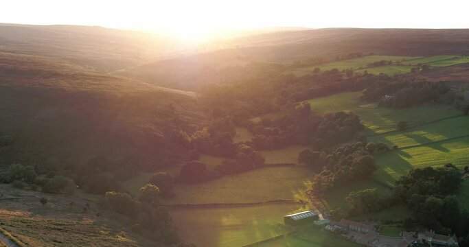 North York Moors, Robin Hoods Bay, Westerdale in summer, Drone Clip 4, shooting towards sun, beautiful valley. Movement: Pull back from valley Inspire 2, 4K, 25fps, H264 DJI Inspire 2