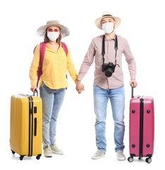 Couple of tourists in medical masks on white background