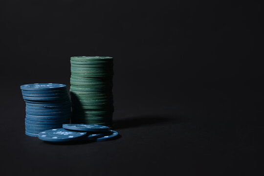 Poker chips on dark background