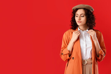 Fototapeta premium Fashionable woman in trench coat and beret, autumn style and urban elegance