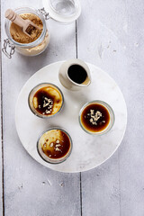 Kurozato panacotta with kuromitsu sauce and sprinkled with roasted kinako powder.  