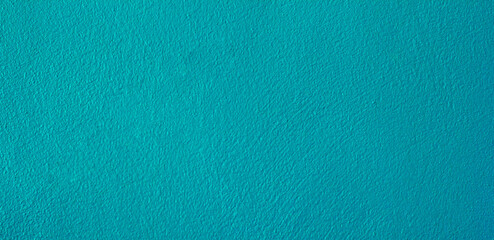 Green concrete wall for texture background and copy space.