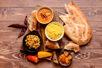 Traditional Indian food on wooden background
