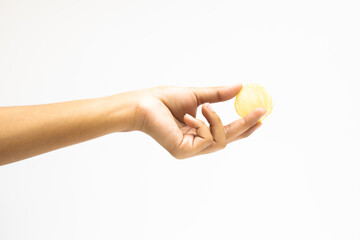 Hand holds potato chips. Isolated on a white background.