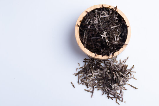 Dried algae shreds on a white background