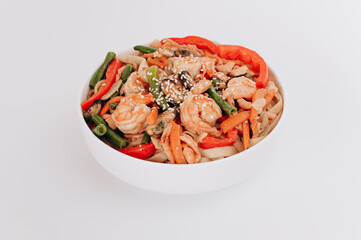 white plate of noodles with seafood