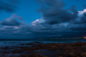 Sea waves crash on the rocks on the shore