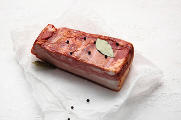 Tasty smoked bacon on light background
