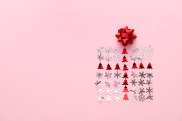 Gift box made of Christmas decor on pink background