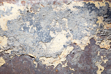 Concrete and paint on a metal surface as an abstract background.