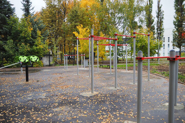 Sports ground with exercise equipment in the open air park.