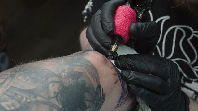 Video of man making tattoo pattern in studio