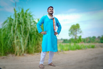 Indian farmer feeling happy and proud in sugarcane field