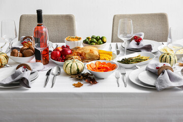 Beautiful table setting with roasted turkey for Thanksgiving dinner