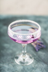 Purple soft lavender cocktail on the rustic background. Selective focus. Shallow depth of field.