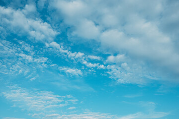 Fototapeta na wymiar Floating Dreams: Serene Clouds in the Azure Sky
