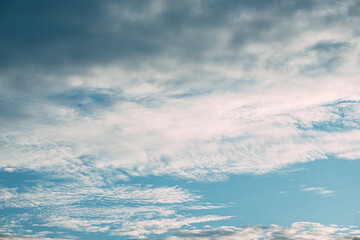 Awe-Inspiring Horizons: Blue Sky and Drifting Clouds