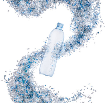Top view of blue plastic bottle with PET bottle  transparent flakes around in white background. Plastic pollution recycle and World Environment Day concept.