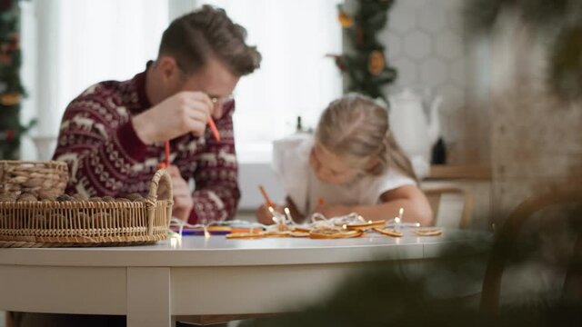 Father and little girl spending Christmas together. Shot with RED helium camera in 8K 
