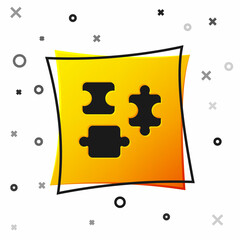 Black Puzzle pieces toy icon isolated on white background. Yellow square button. Vector