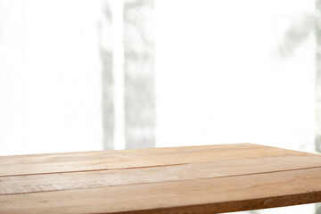 blurred light window background with table