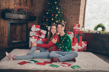 Full length photo of young lovely couple happy positive smile hug cuddle decoration christmas spirit indoors