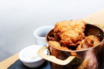Delicious fried chicken with sauce