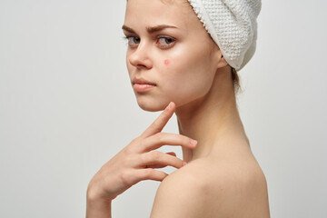 beautiful woman with a towel on my head dermatology isolated background