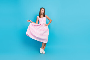 Full body photo of happy charming young woman fly skirt enjoy weekend summer isolated on blue color background